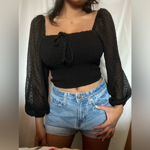 Black crop top. Very soft and had bubble sleeves that are see throught. - Picture 2 of 7